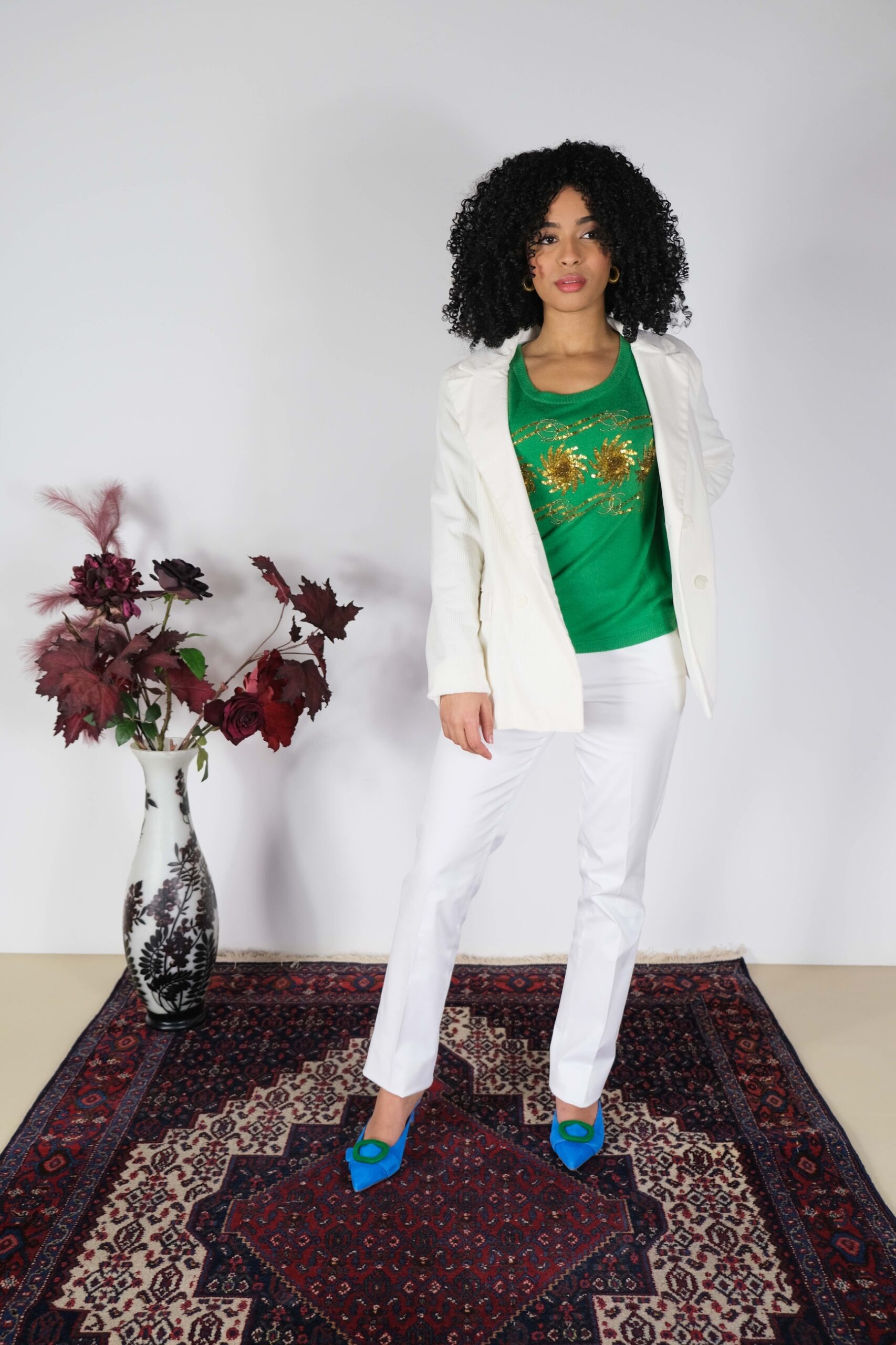 Green cashmere sweater with gold embellishment